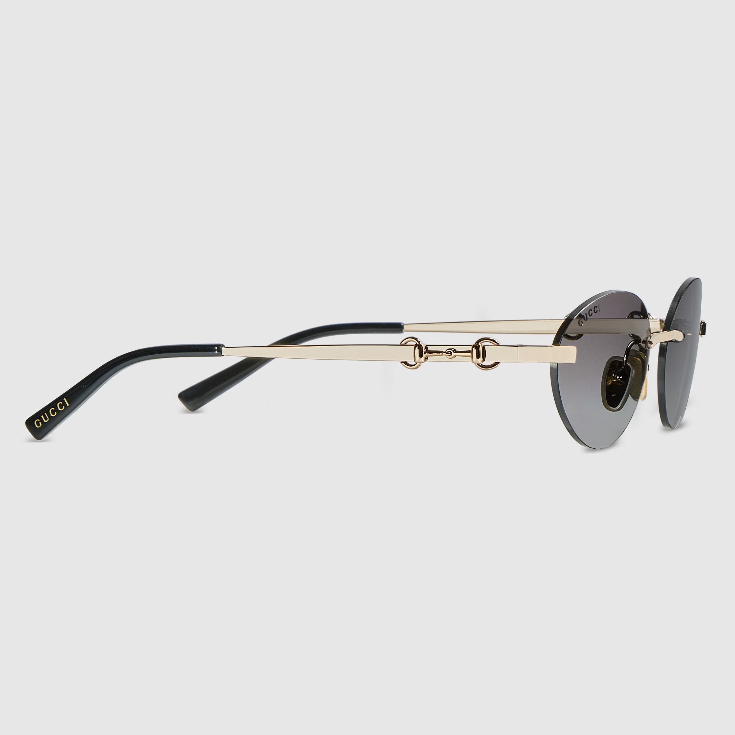 Gucci Women Frameless Oval Frame Gold Toned Sunglasses